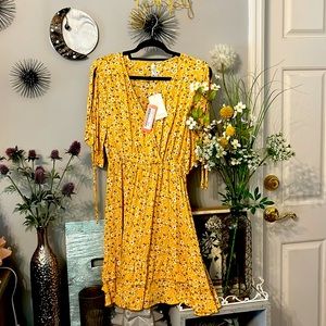 Brand new never worn floral print open sleeve dress .